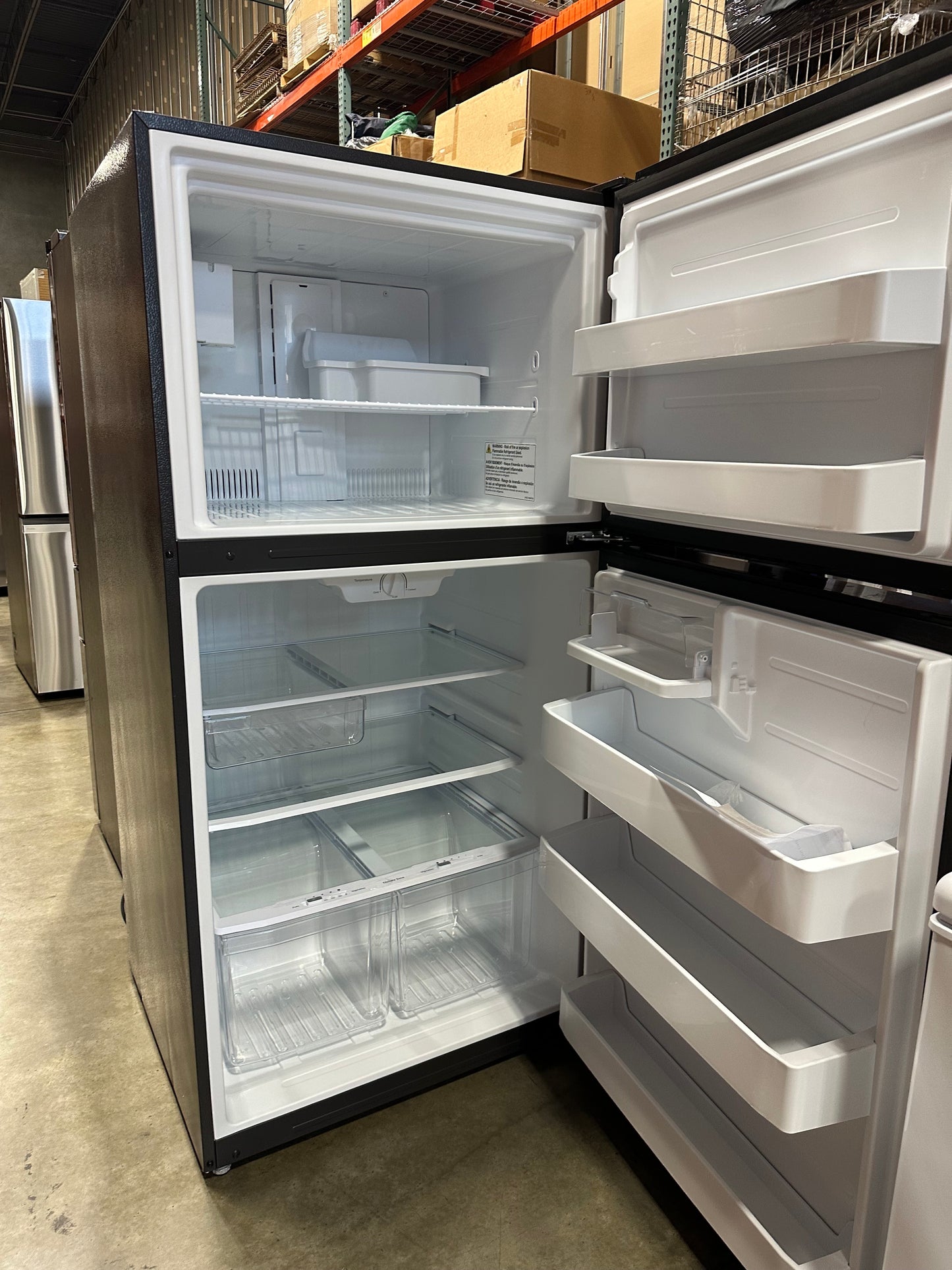 GE 21.1 cu. ft. Top Freezer Refrigerator in Stainless Steel, GIE21GSHHSS MSRP $1484